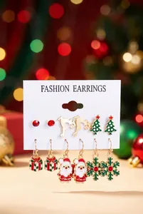 Set of Christmas-themed enamel earrings with Santa, reindeer, and snowflakes