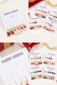Christmas earring set featuring reindeer, Santa, and snowflake enamel designs on cards