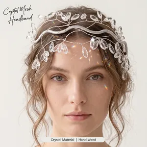 Elegant detail of a handmade crystal mesh headband on a model for bridal wear
