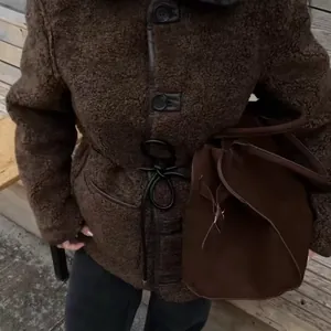 Fashionable brown sherpa teddy coat with waist tie for women, autumn outerwear style