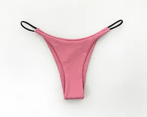 Detail view of pink low-waist T-style thong with black double thin straps