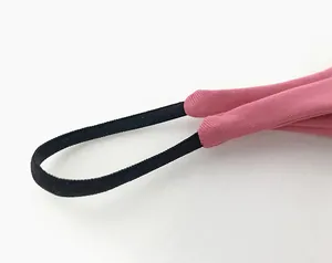 Detailed close-up of pink low waist cotton T-back thong with black elastic strap.
