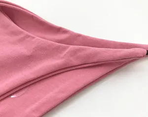 Close-up macro view of pink double-layer cotton thong showing fine knit fabric texture