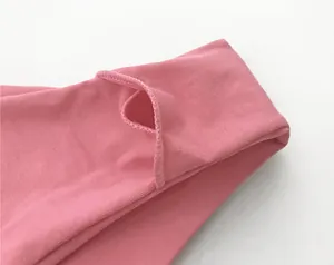 Macro close-up view of the pink double-layer cotton fabric on a ladies T-back panty.
