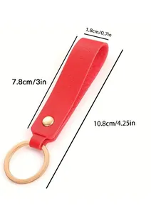 Detailed dimensions of a red leather keychain with golden ring on white background