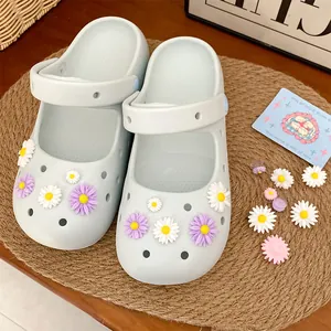 Close-up of colorful resin daisy charms for clogs and DIY shoe accessories