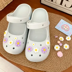 Close-up detail of colorful resin daisy flower charms for DIY clogs and garden sandals