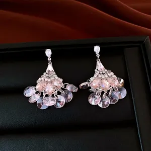 Vintage fan-shaped tassel earrings with shimmering pink crystals and silver needle studs