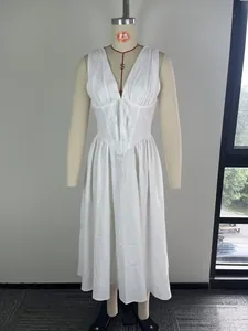 Close-up detail of an elegant white V-neck cinched waist midi dress on dress form