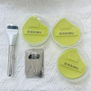 Professional makeup tool set with three green puffs, a foundation brush and palette
