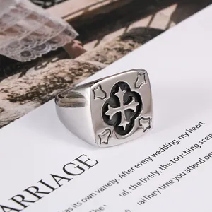Vintage men's stainless steel signet ring featuring a detailed gothic cross engraving
