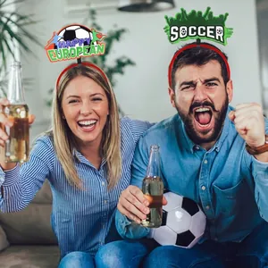 Soccer fans cheering while wearing creative football themed headbands for match day celebrations