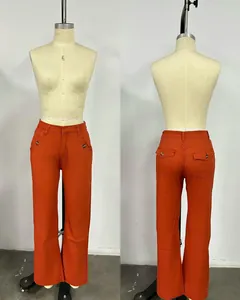 Front and back detail view of orange high-waisted wide-leg trousers on a mannequin