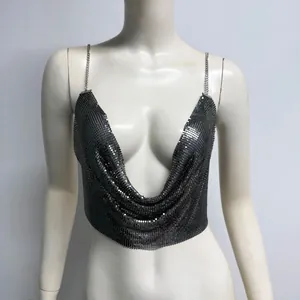 Close-up detail of sexy metallic aluminum mesh sequin halter top with chain straps