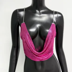 Close-up of pink metallic aluminum mesh halter top with elegant silver chain straps
