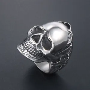 Bold gothic stainless steel skull ring featuring intricate floral wreath carving for men