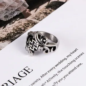 Vintage gothic titanium steel ring with floral vine patterns and cross emblem
