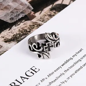 Vintage titanium steel men's ring featuring intricate vine patterns and a cross motif.