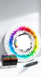 Professional dual-tip alcohol markers with detailed circular color system chart background