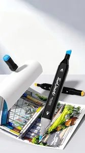 Close-up of Touchmark professional dual-tip alcohol markers on architectural drawing