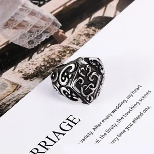 Vintage titanium steel ring with intricate floral patterns for men and women