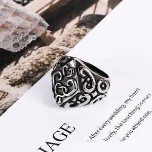 Vintage stainless steel ring with intricate scrollwork patterns for men and women