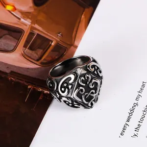 Vintage stainless steel ring featuring intricate scroll patterns for men and women