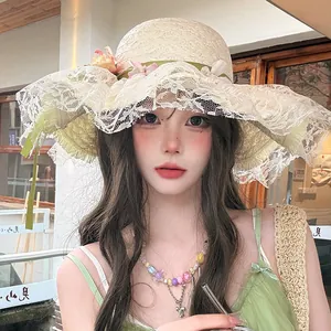 Elegant French style straw sun hat featuring a wide lace brim and floral decorations
