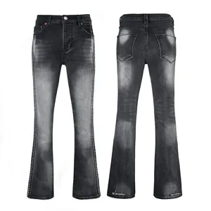 Front and back views of men's distressed black flare jeans with studded side trim
