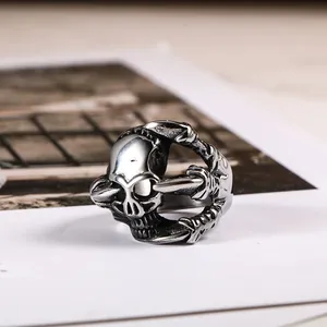 Retro punk titanium steel skull ring for men with gothic claw design and antique silver finish.