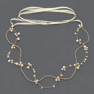 Elegant pearl and crystal bridal hair vine with cream ribbon for wedding styling