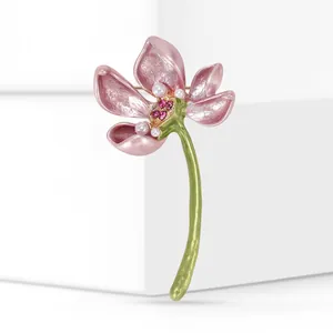Detailed macro view of an elegant pink lotus alloy brooch with pearls and rhinestones.