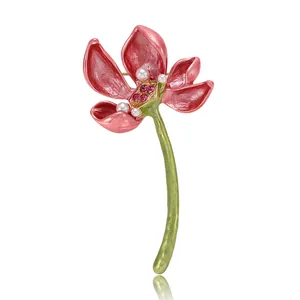 Elegant pink enamel lotus flower brooch featuring pearl and red rhinestone details