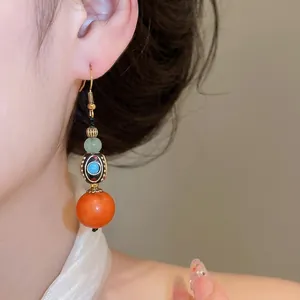 Exquisite Neo-Chinese ethnic drop earrings featuring colorful resin beads on a model
