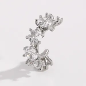Close-up of elegant silver-tone cuff earring set with sparkling round cubic zirconia.