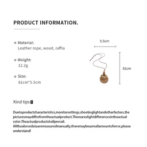 Handmade ethnic raffia and wood pendant necklace on leather rope with product dimensions