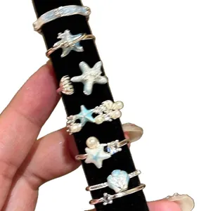 Collectie oceaanthema open ringen met blauwe zeester en parel voor dames, vakantiestijl