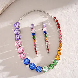 Exquisite close-up of a rainbow gradient rhinestone necklace and matching earrings