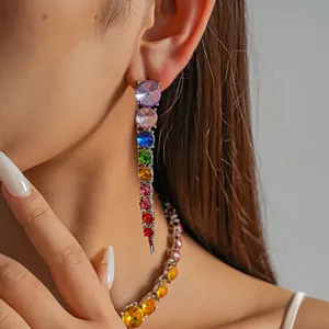 Close-up detail of rainbow gradient rhinestone drop earrings and matching necklace set.