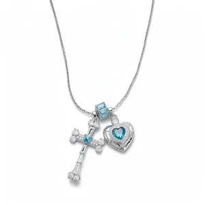 Elegant silver necklace featuring a blue zircon heart locket and a sparkling cross pendant