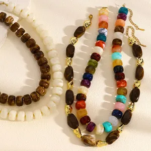 Close-up detail view of colorful dopamine beaded necklaces for summer beach fashion trends