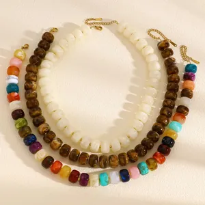 Detailed view of colorful dopamine-style beaded necklaces for summer beach fashion.