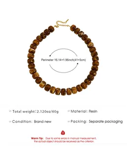 Detail view of the brown resin beaded necklace with product dimensions and weight specs