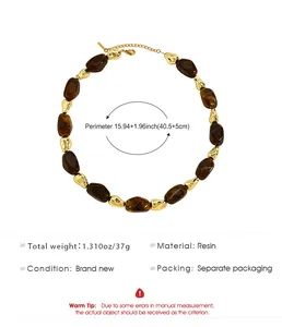 Detail view of a resin beaded necklace with gold accents showing measurement specs