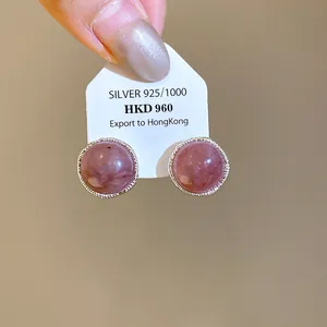 Elegant vintage pink agate stone stud earrings with decorative silver-toned settings
