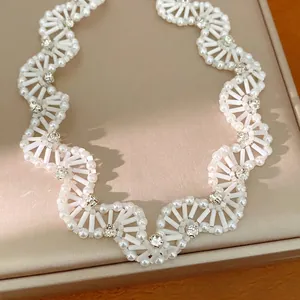 Elegant white beaded lace necklace with sparkling rhinestones in vintage palace style.