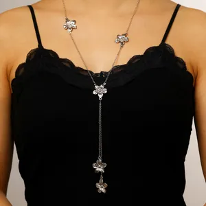 Elegant silver flower Y-shaped long necklace with petal tassel charms worn by model