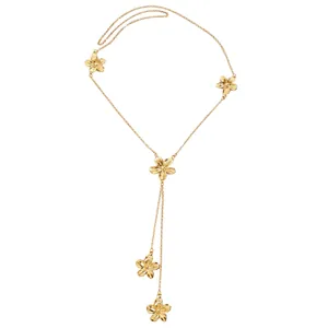 Detail view of the golden Y-shaped sweater necklace with elegant flower petal charms