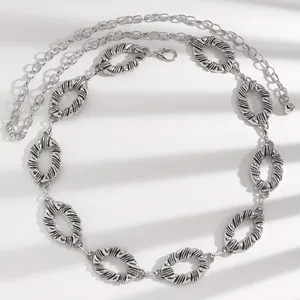 Bohemian silver waist chain belt featuring textured oval metal rings for dresses