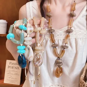 Stylish bohemian acrylic bead necklace with leather cord for trendy beach vacation looks